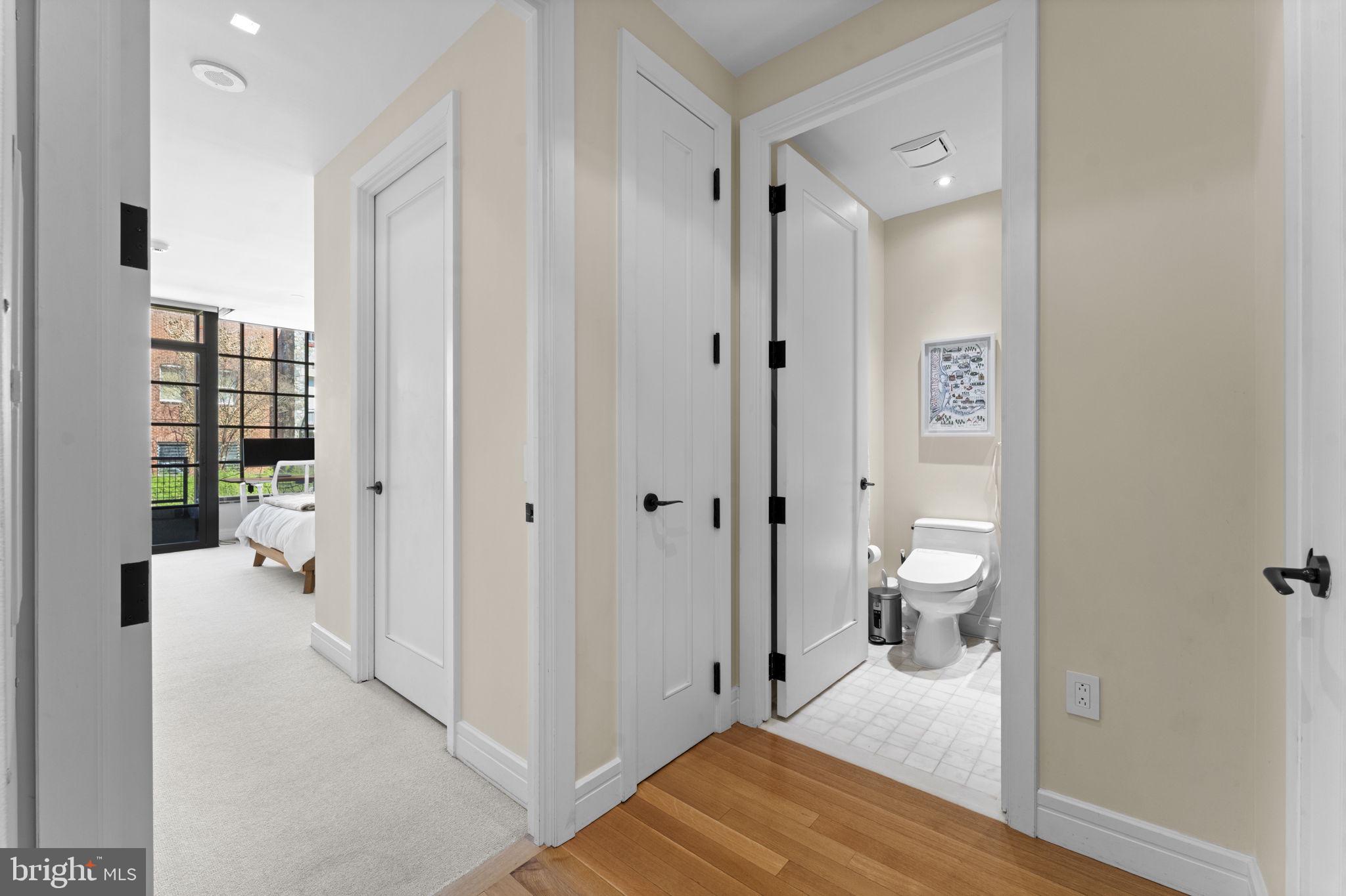 3303 Water Street Northwest, Unit 4B Washington, DC 20007 - Photo 21 of 66 a bathroom with a granite countertop sink a toilet and shower