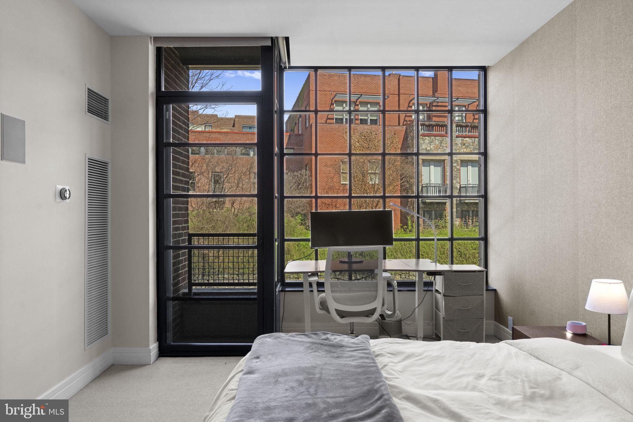 3303 Water Street Northwest, Unit 4B Washington, DC 20007 - Photo 29 of 66 a bedroom with a bed and a window