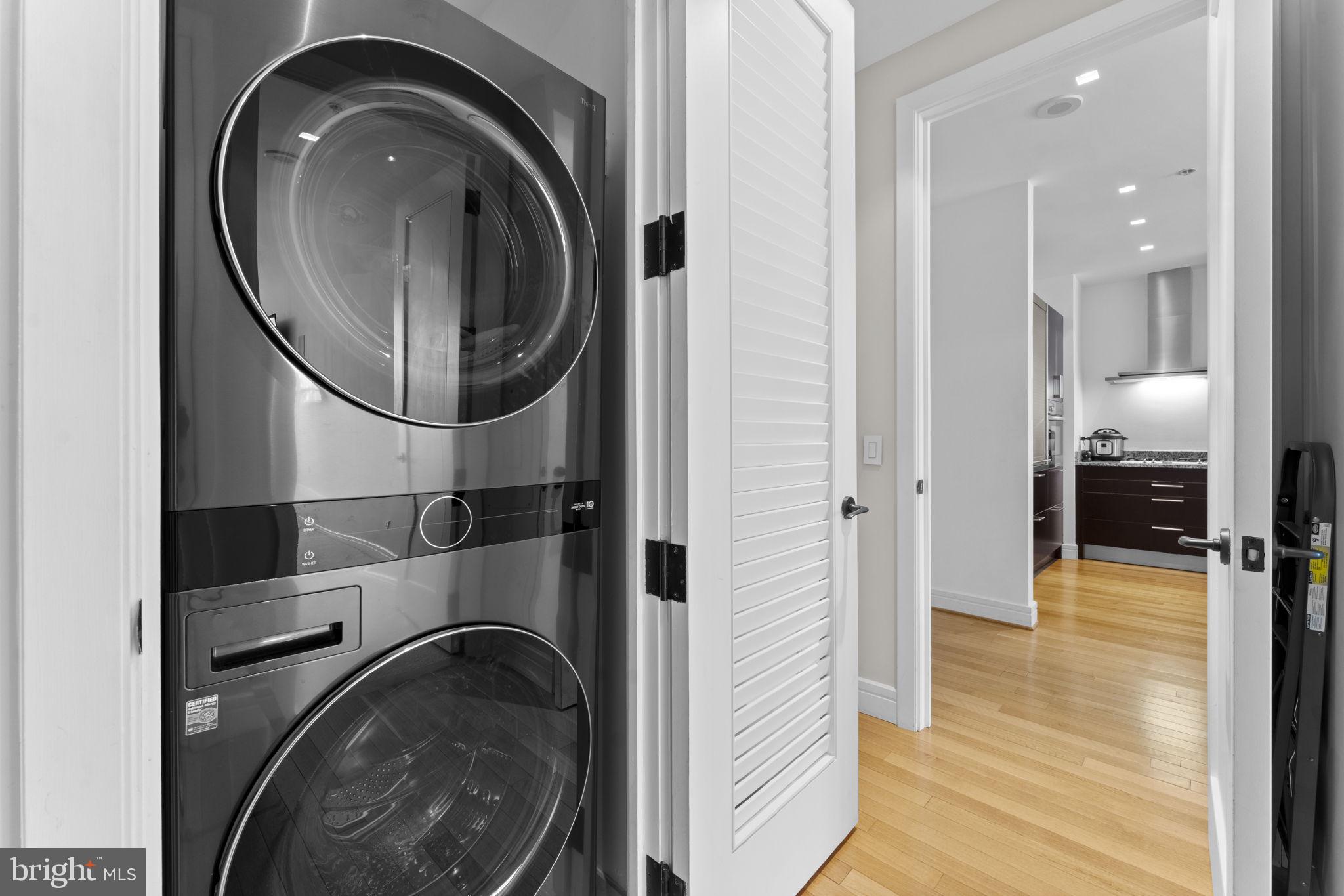 3303 Water Street Northwest, Unit 4B Washington, DC 20007 - Photo 31 of 66 a view of a hallway with washer and dryer