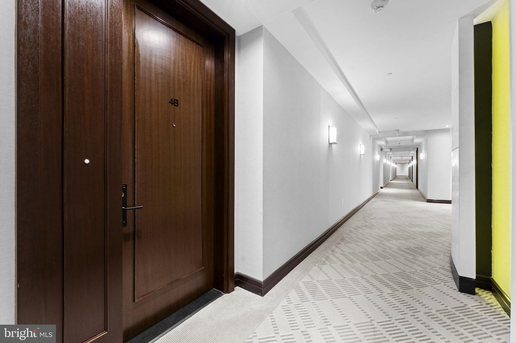 3303 Water Street Northwest, Unit 4B Washington, DC 20007 - Photo 32 of 66 a view of hallway with wooden floor