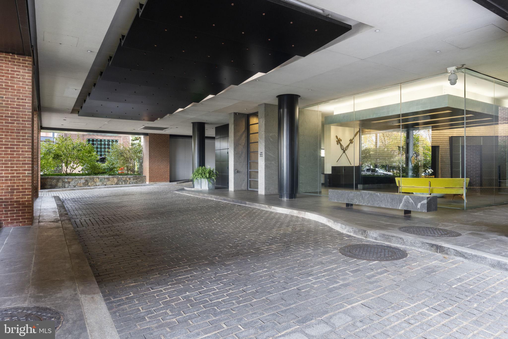 3303 Water Street Northwest, Unit 4B Washington, DC 20007 - Photo 4 of 66 a view of a porch with a table and chairs under an umbrella