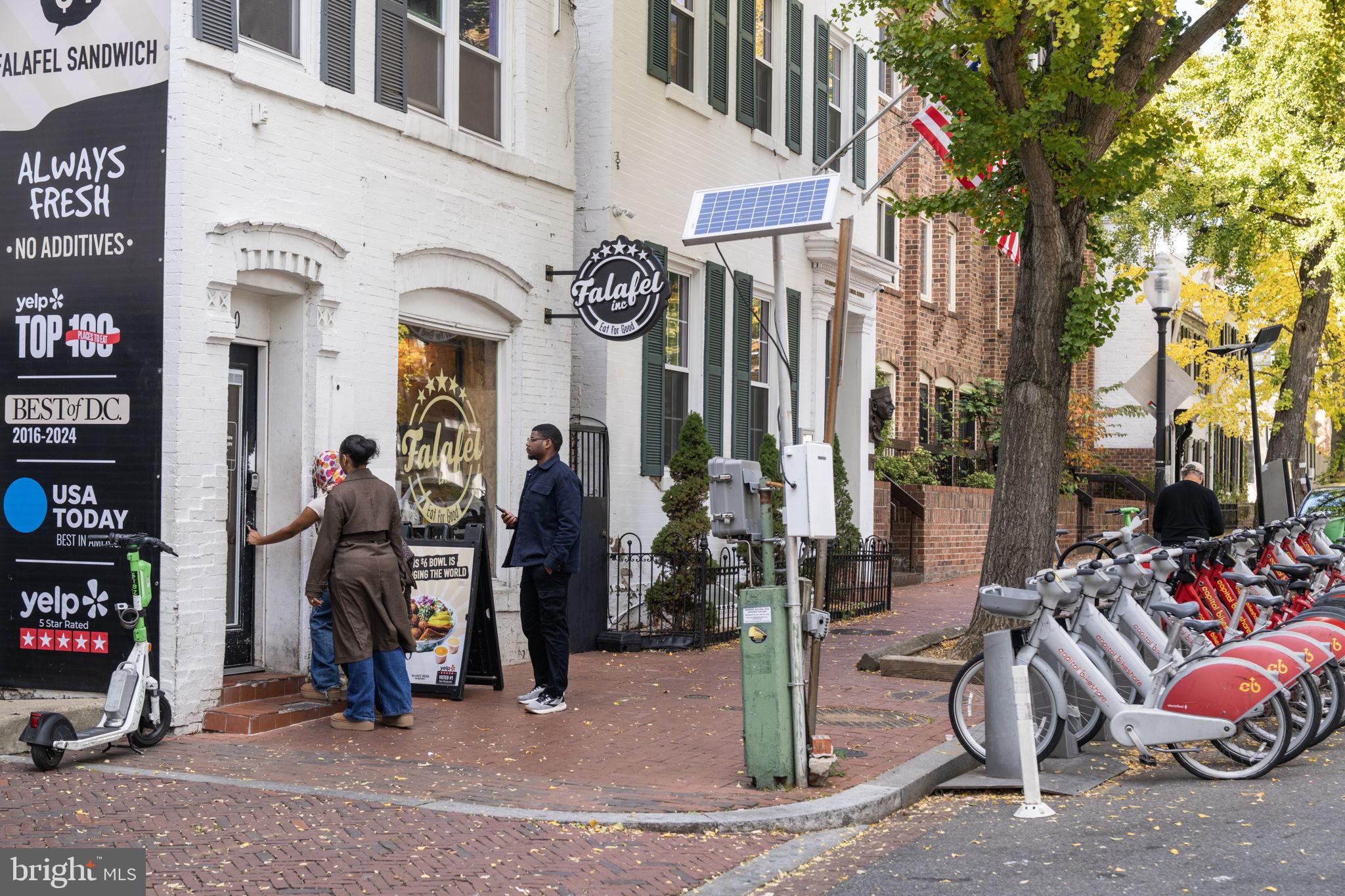 3303 Water Street Northwest, Unit 4B Washington, DC 20007 - Photo 45 of 66 a view of path along with retail shop and buildings