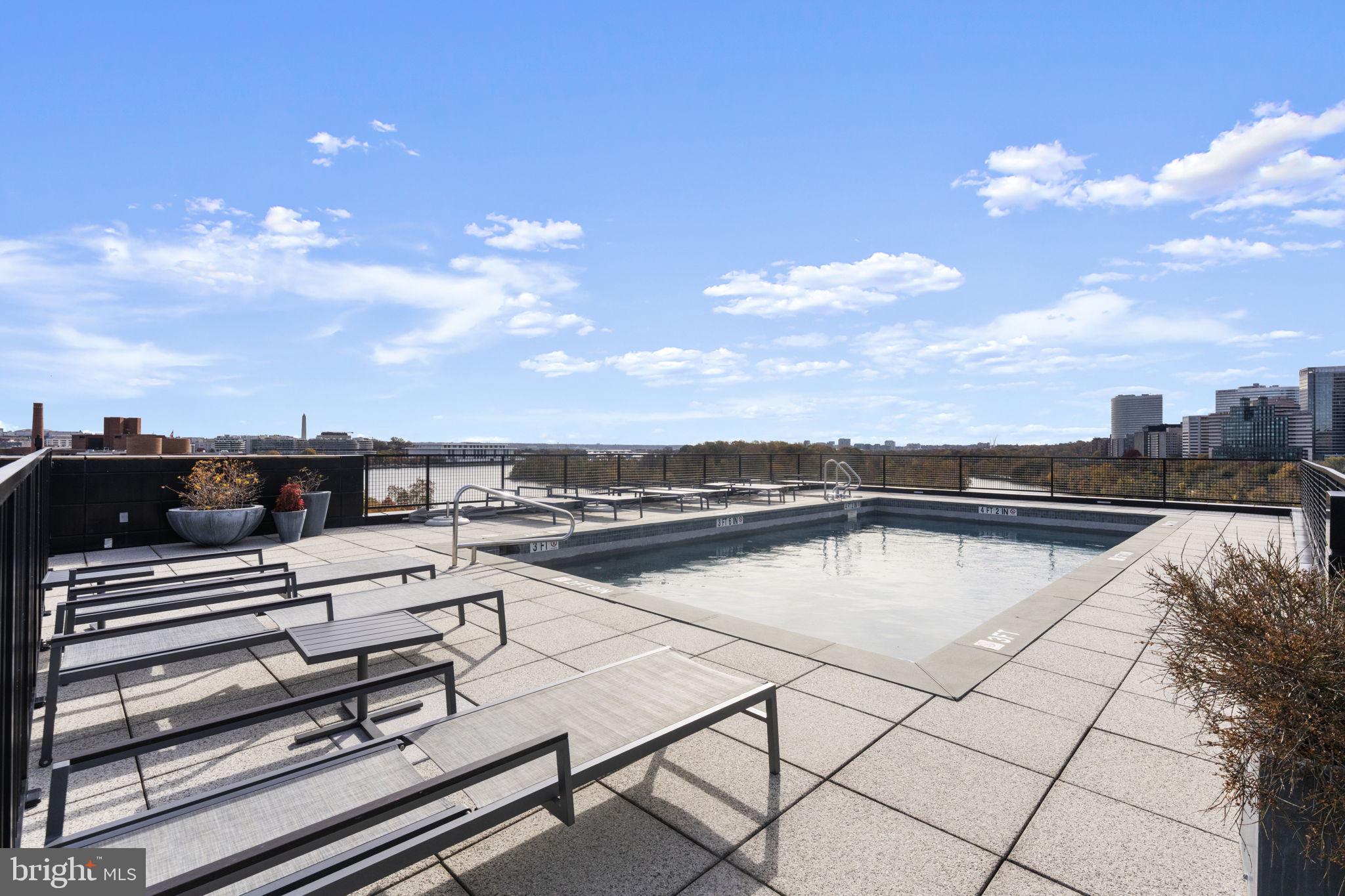 3303 Water Street Northwest, Unit 4B Washington, DC 20007 - Photo 56 of 66 a view of a terrace with sitting area