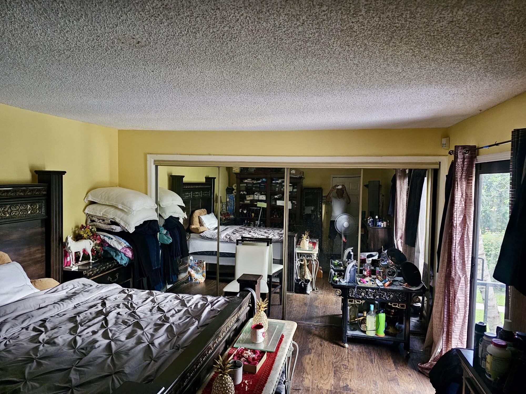 2860 Kirk Road Lake Worth, FL 33461 - Photo 11 of 13 a bedroom with furniture and a large window