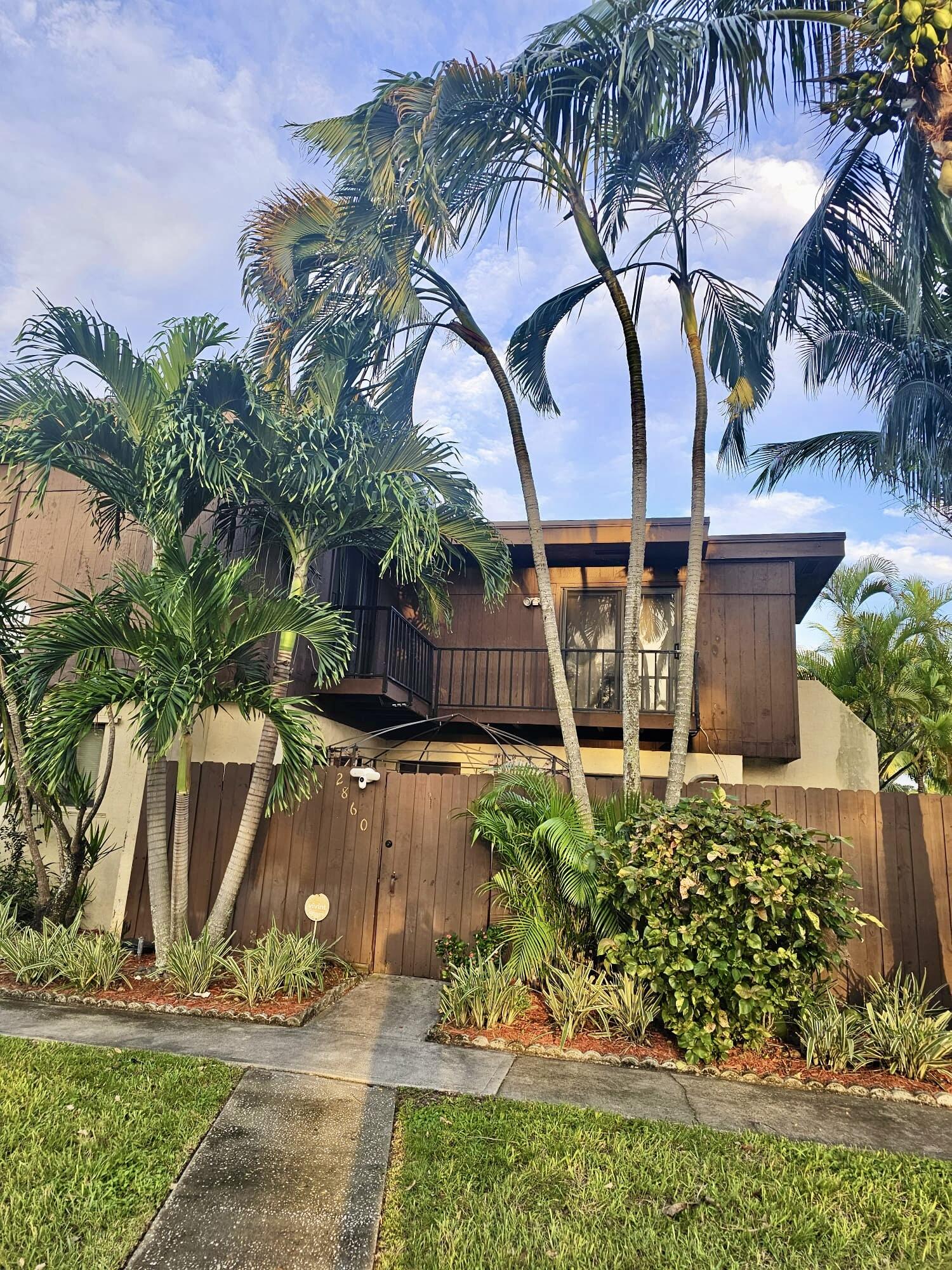 2860 Kirk Road Lake Worth, FL 33461 - Photo 13 of 13 a front view of a house with garden