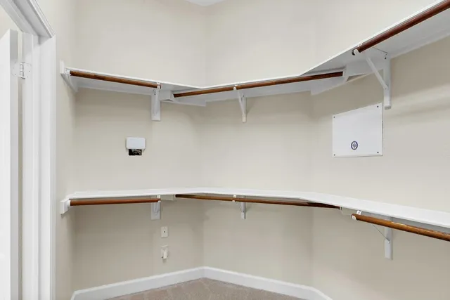 a view of hallway with wooden floor