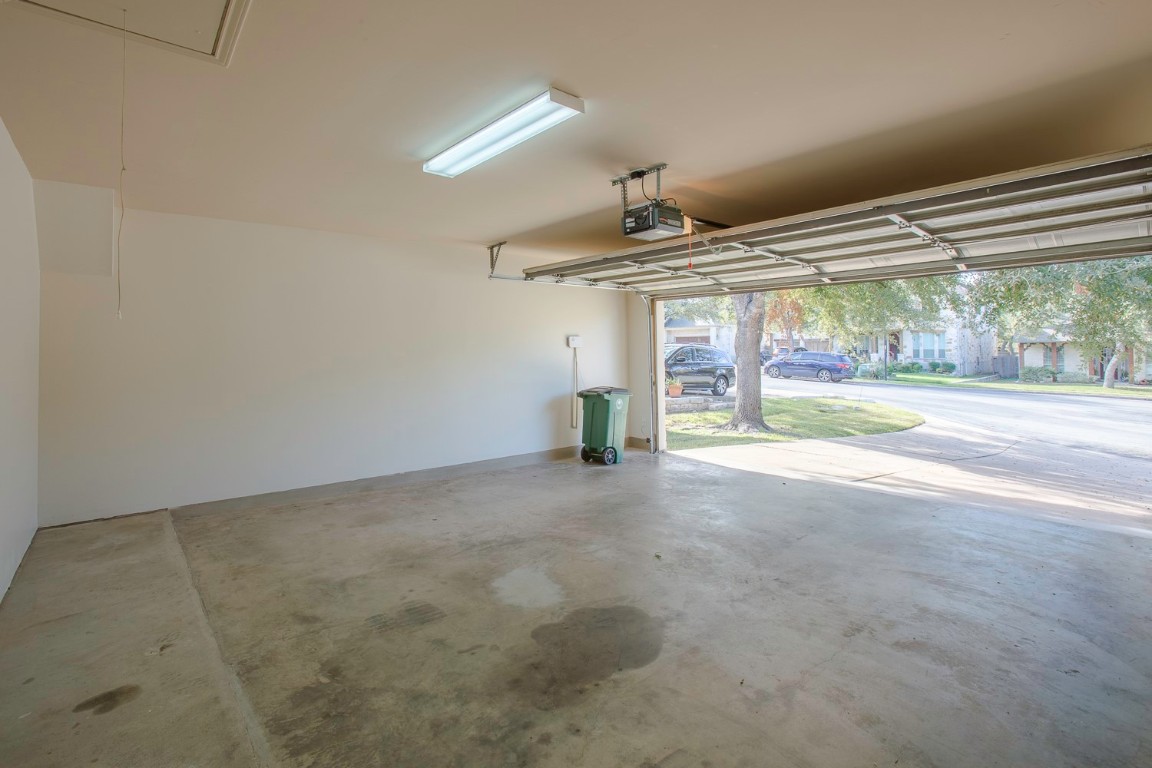 10805 Ariock Lane Austin, TX 78739 - Photo 32 of 40 Garage with a garage door opener