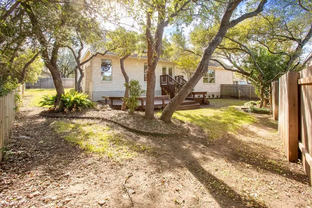 a view of a backyard with sitting area