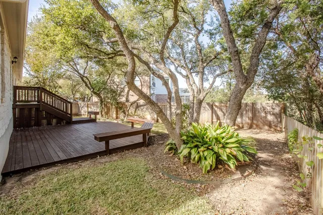 a view of a yard with a tree