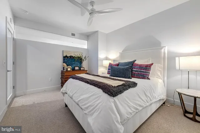 a bedroom with bed and a lamp