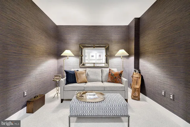 a living room with furniture and a lamp