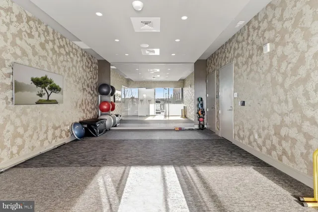 a view of a hallway with stairs