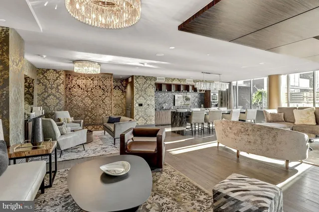 a living room with furniture and a table