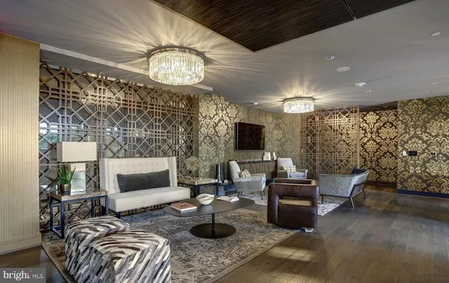 a living room with furniture a rug and a fireplace