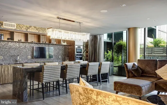 a view of a patio with couches chairs dining table and chairs