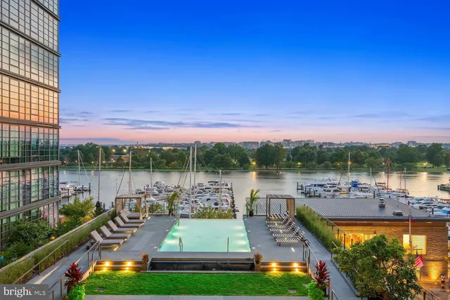 a view of a lake from a balcony with outdoor space