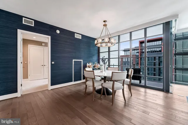 a view of a dining room with furniture window and wooden floor