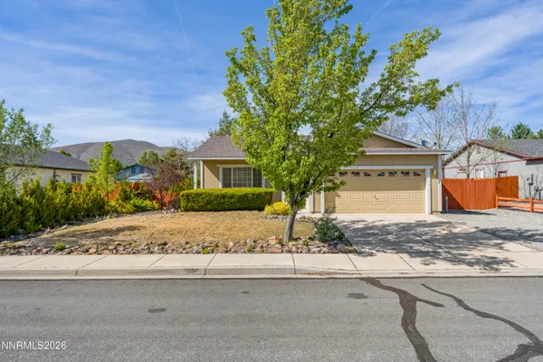 a house with a tree in front of it