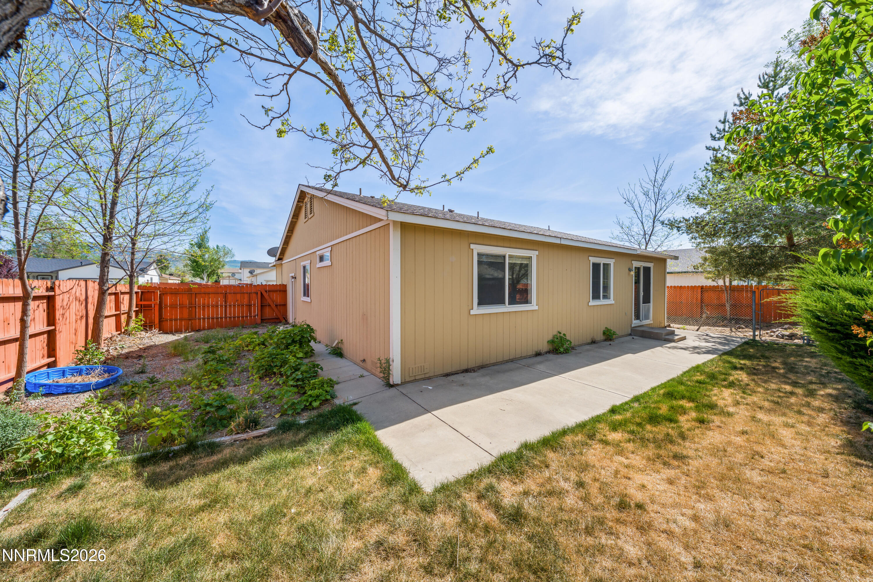 17617 Grand Valley Court Reno, NV 89508 - Photo 13 of 15 a view of backyard of house with wooden fence