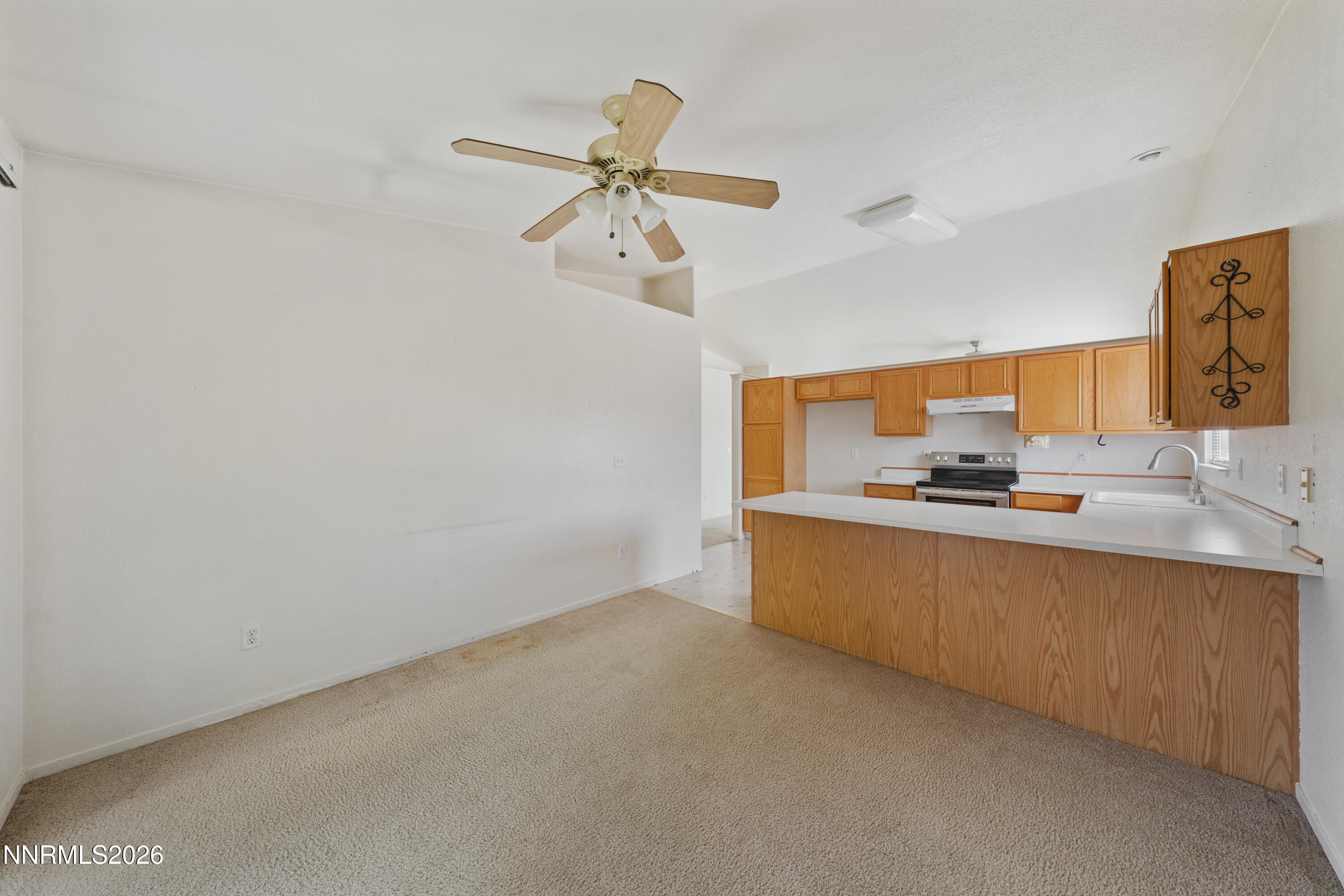17617 Grand Valley Court Reno, NV 89508 - Photo 5 of 15 a room with a sink cabinets and a window