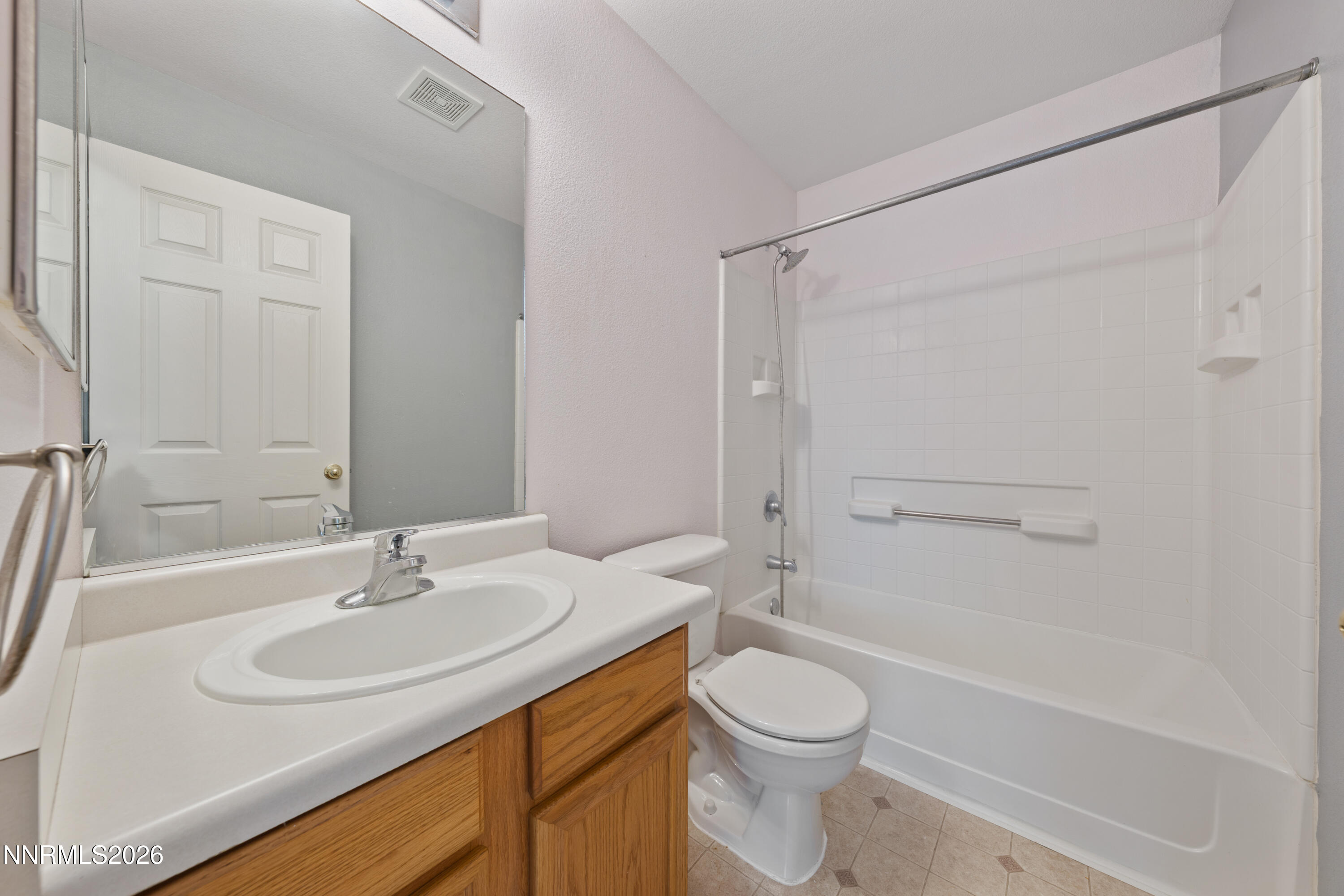 17617 Grand Valley Court Reno, NV 89508 - Photo 7 of 15 a bathroom with a sink a toilet and shower