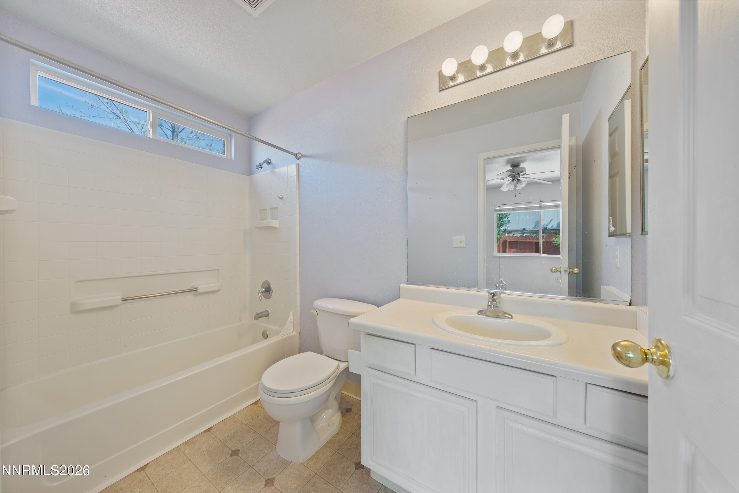 17617 Grand Valley Court Reno, NV 89508 - Photo 9 of 15 a bathroom with a sink a toilet and shower