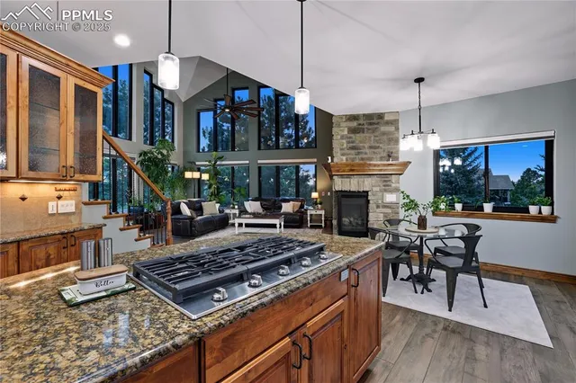 a living room with fireplace furniture a dining table and a fireplace