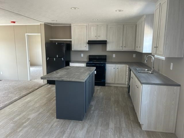 2958 Basstown Road Clinton, NC 28328 - Photo 3 of 7 a kitchen with stainless steel appliances granite countertop a stove a sink and a refrigerator