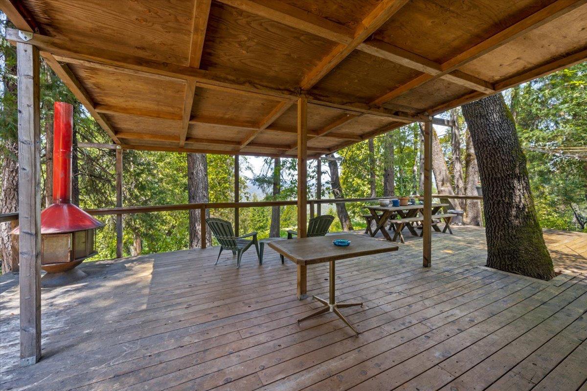 19643 Sages Road Nevada City, CA 95959 - Photo 20 of 39 a view of a chairs and table in patio with wooden floor