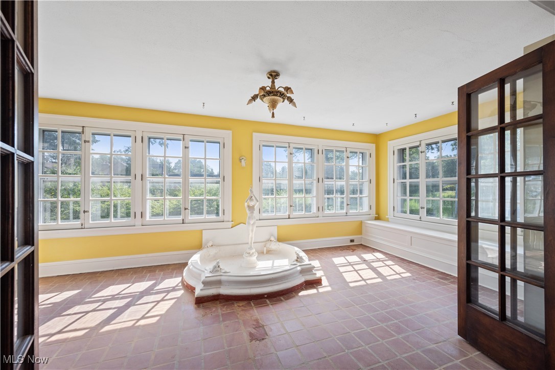 24510 Lake Road Bay Village, OH 44140 - Photo 10 of 45 Sunroom featuring baseboards