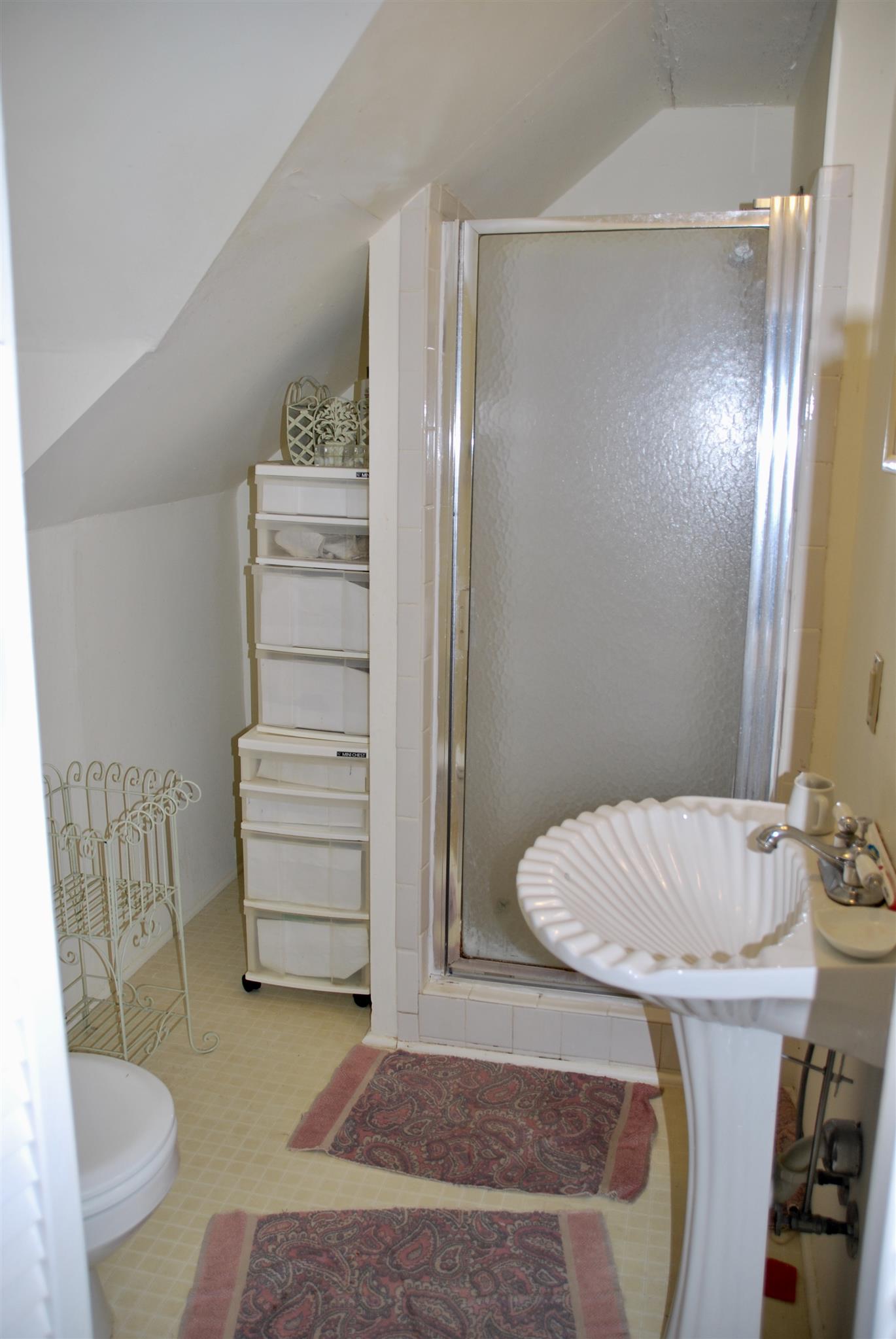 906 Estes Road Nashville, TN 37215 - Photo 13 of 15 a bathroom with a sink toilet and shower