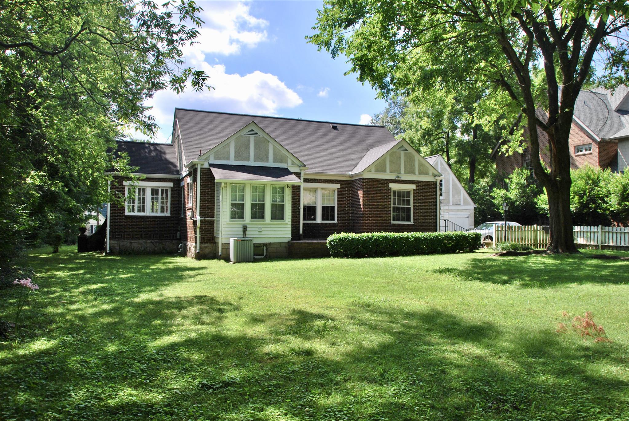 906 Estes Road Nashville, TN 37215 - Photo 15 of 15 a front view of a house with a yard and trees