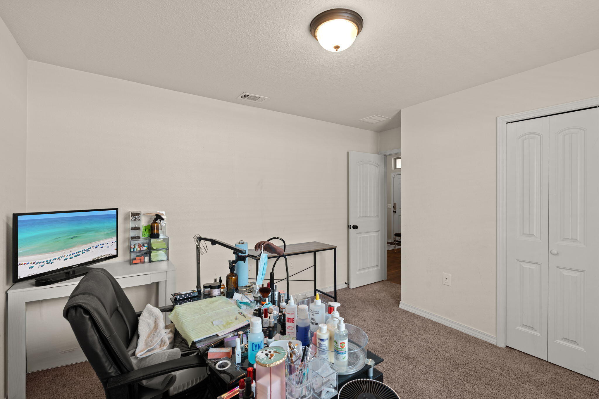 124 Lillian Way Crestview, FL 32536 - Photo 28 of 31 a living room with furniture and a flat screen tv