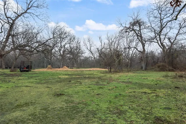 a view of outdoor space with deck and yard