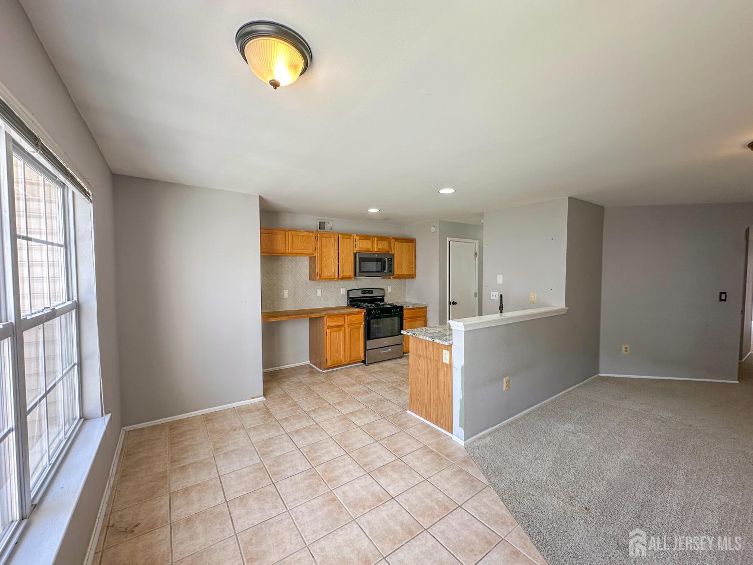 1212 Plymouth Road North Brunswick, NJ 08902 - Photo 10 of 27 a view of kitchen with wooden floor