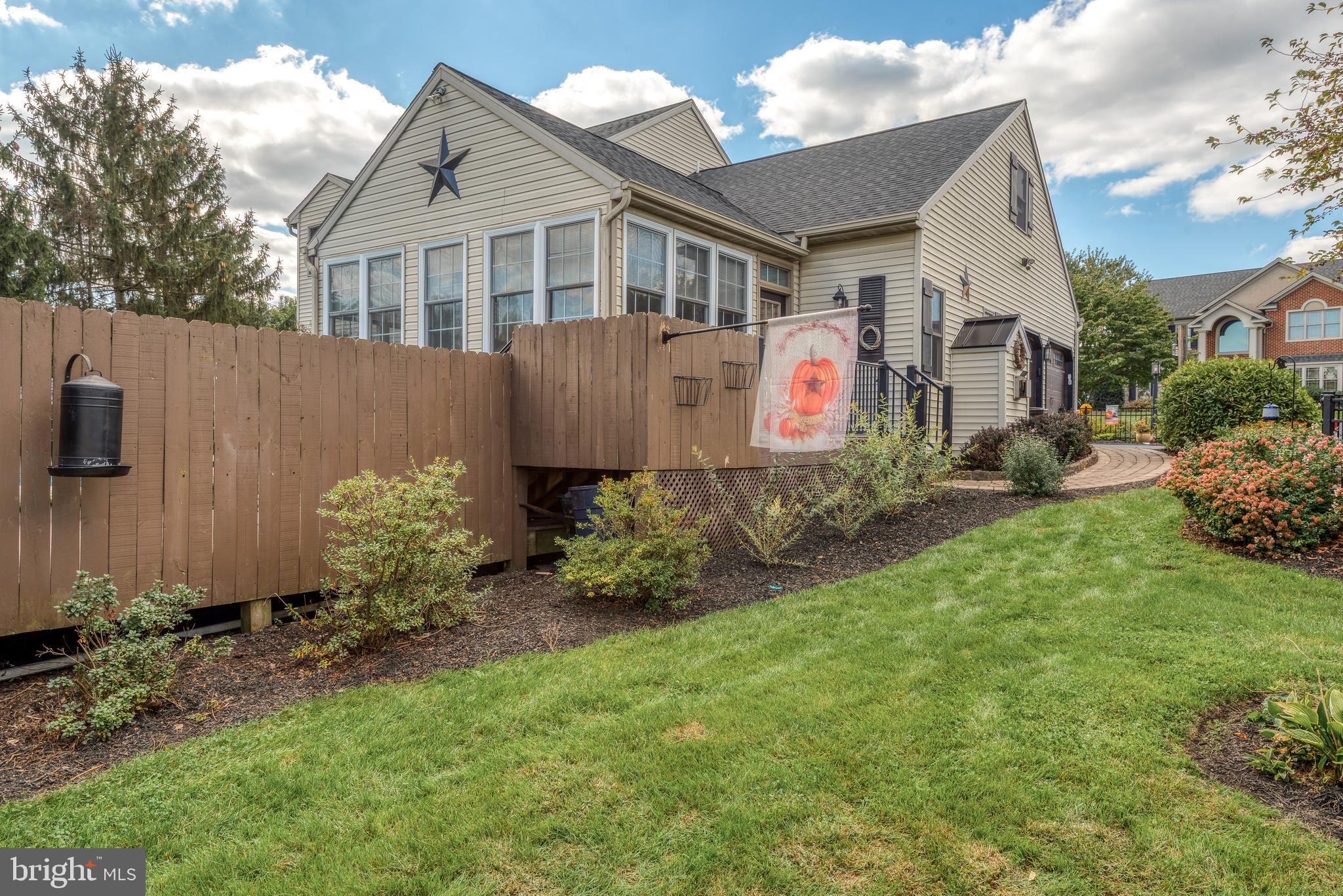 5 Village Drive Lititz, PA 17543 - Photo 53 of 62 a front view of a house with a yard and potted plants