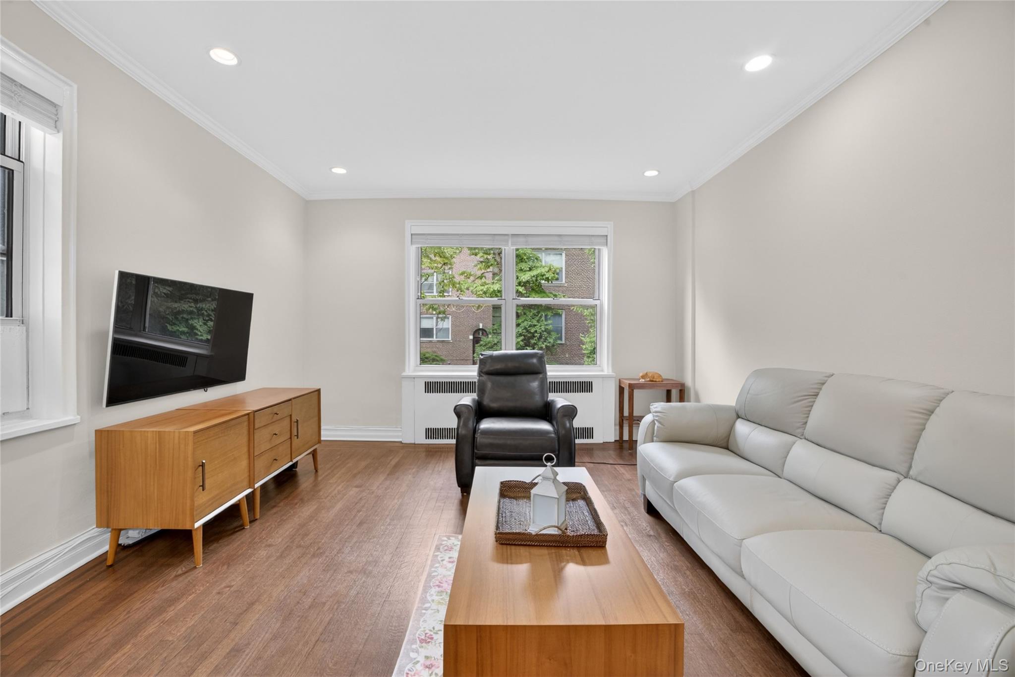 824 Palmer Road, Unit 1F Bronxville, NY 10708 - Photo 7 of 26 a living room with furniture and a flat screen tv