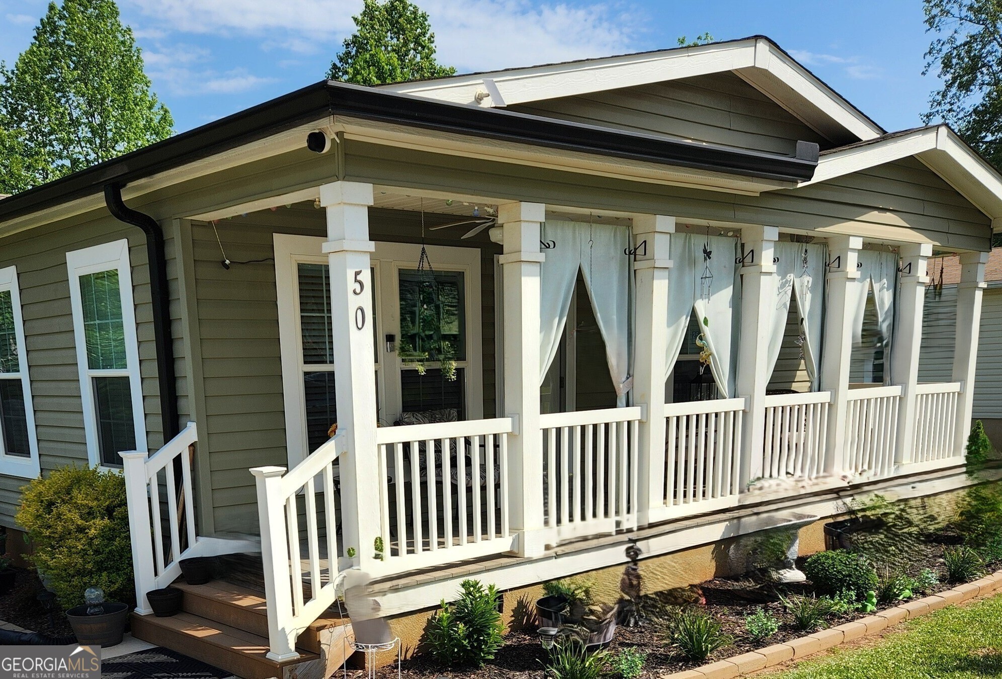 a view of a house with a porch