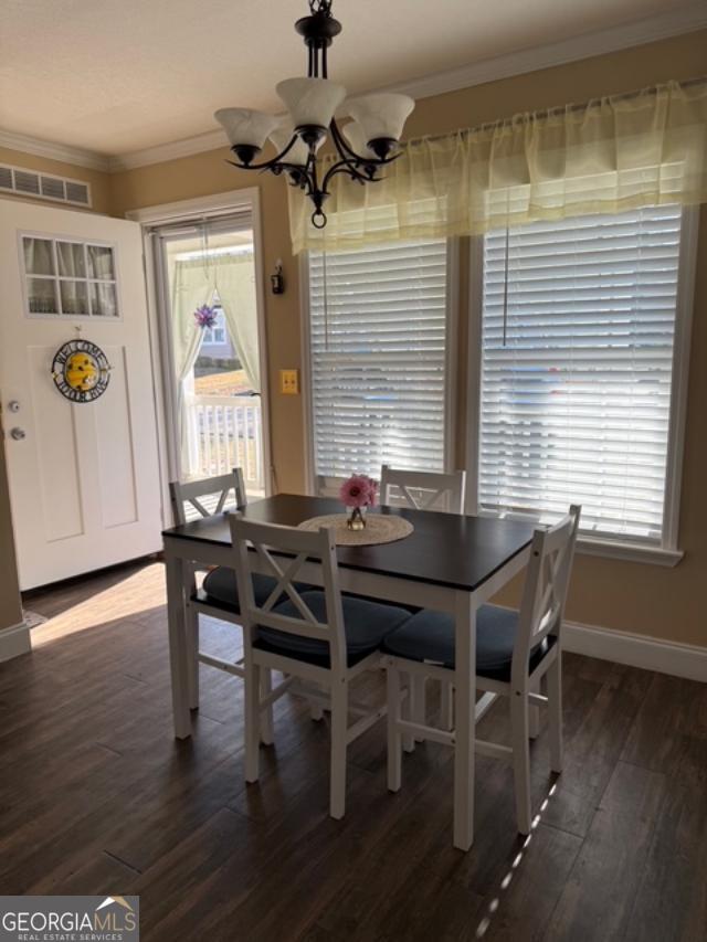 50 Meadowview Street Newnan, GA 30263 - Photo 6 of 26 a view of a dining room with furniture and wooden floor