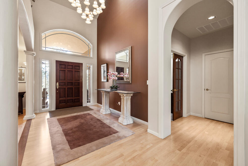 11629 Merganser Road Klamath Falls, OR 97601 - Photo 6 of 50 an entryway with a chandelier and a livingroom