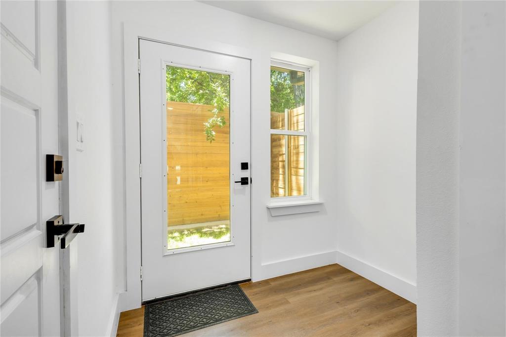 2011 Kirby Street, Unit 105 Dallas, TX 75204 - Photo 5 of 32 a view of an entryway with wooden floor and a window