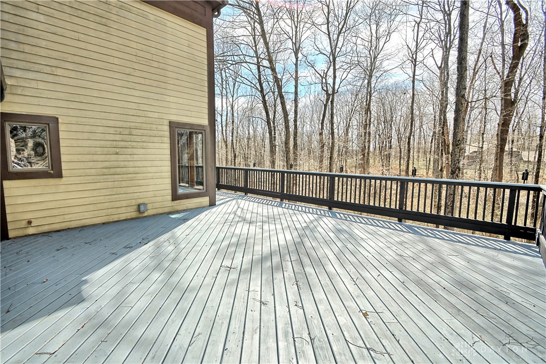 8711 Nicole Lane Springboro, OH 45066 - Photo 78 of 87 This spacious deck offers a tranquil retreat with expansive views of the surrounding woods.