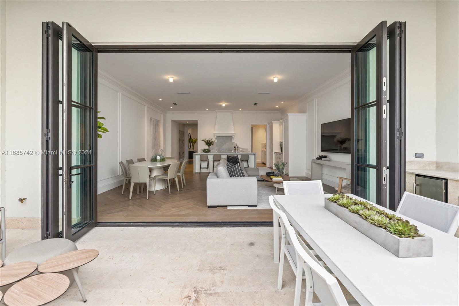 2619 Anderson Road Coral Gables, FL 33134 - Photo 17 of 63 a living room with stainless steel appliances kitchen island granite countertop furniture a sink a rug and a view of kitchen