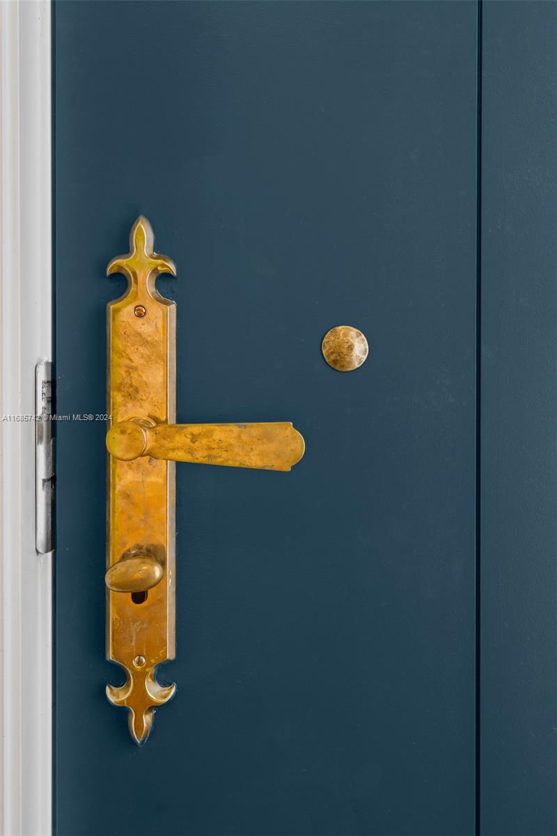 2619 Anderson Road Coral Gables, FL 33134 - Photo 2 of 63 a blue plant sitting in a bathroom next to a window