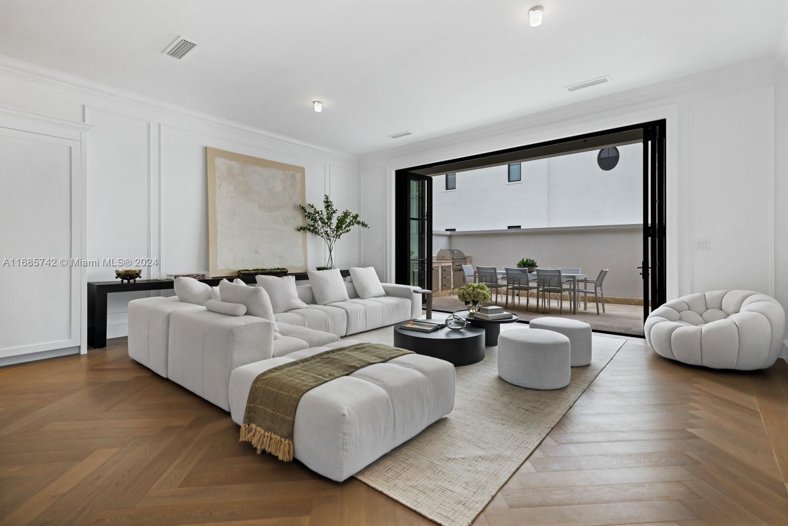 2619 Anderson Road Coral Gables, FL 33134 - Photo 27 of 63 a living room with furniture and a large window