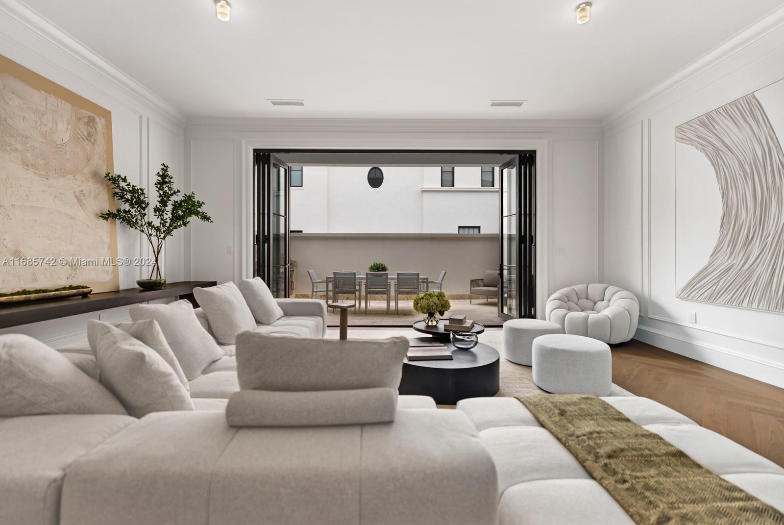 2619 Anderson Road Coral Gables, FL 33134 - Photo 28 of 63 a living room with furniture and a large window