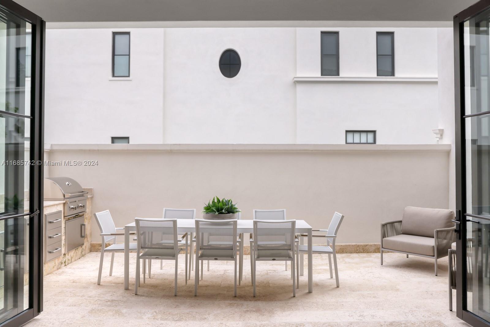 2619 Anderson Road Coral Gables, FL 33134 - Photo 38 of 63 a view of kitchen with furniture and wooden floor