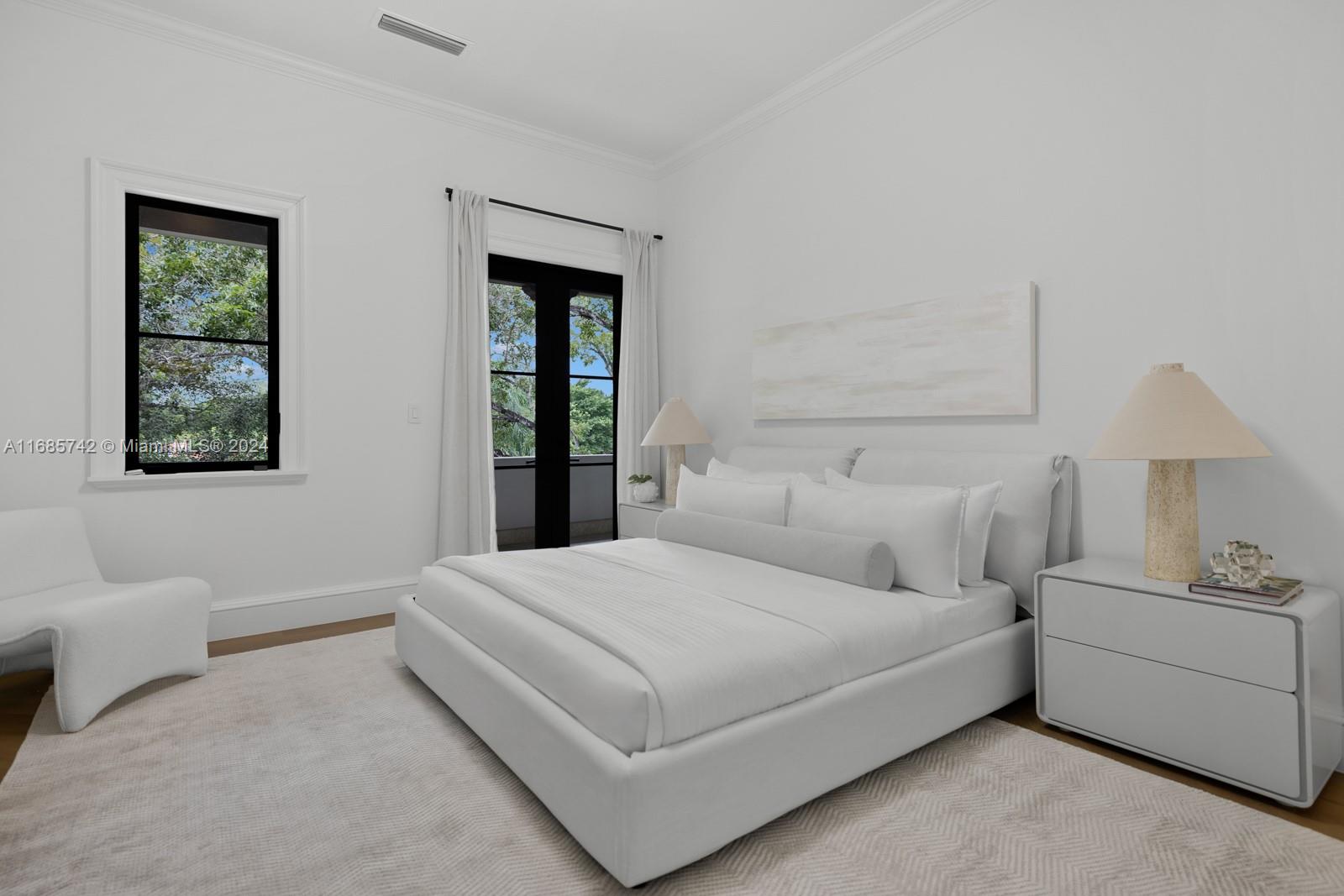 2619 Anderson Road Coral Gables, FL 33134 - Photo 44 of 63 a bedroom with a bed and a couch