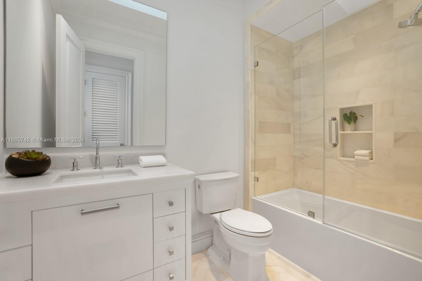 2619 Anderson Road Coral Gables, FL 33134 - Photo 52 of 63 a bathroom with a sink a toilet and shower