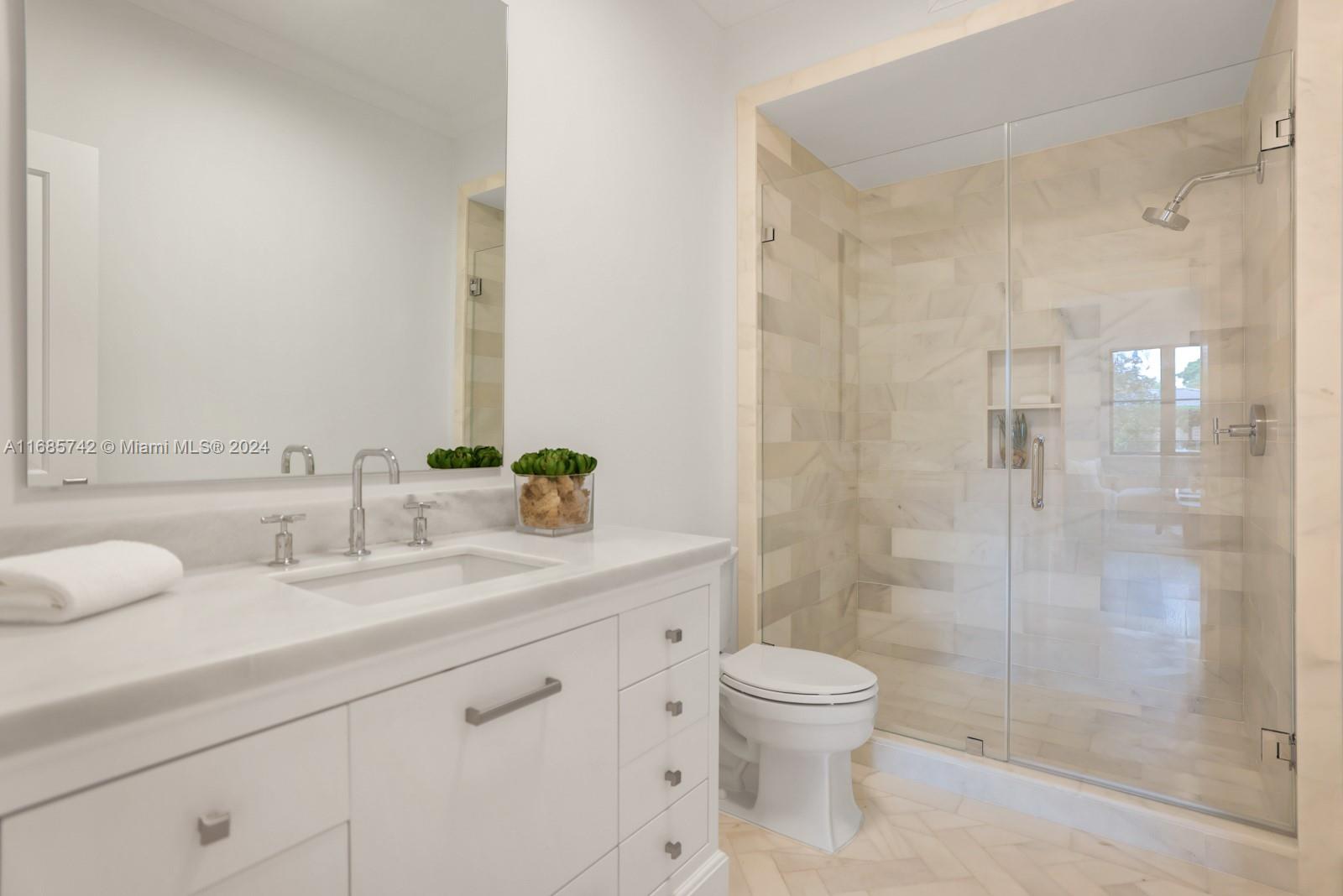 2619 Anderson Road Coral Gables, FL 33134 - Photo 58 of 63 a bathroom with a granite countertop sink a toilet and shower